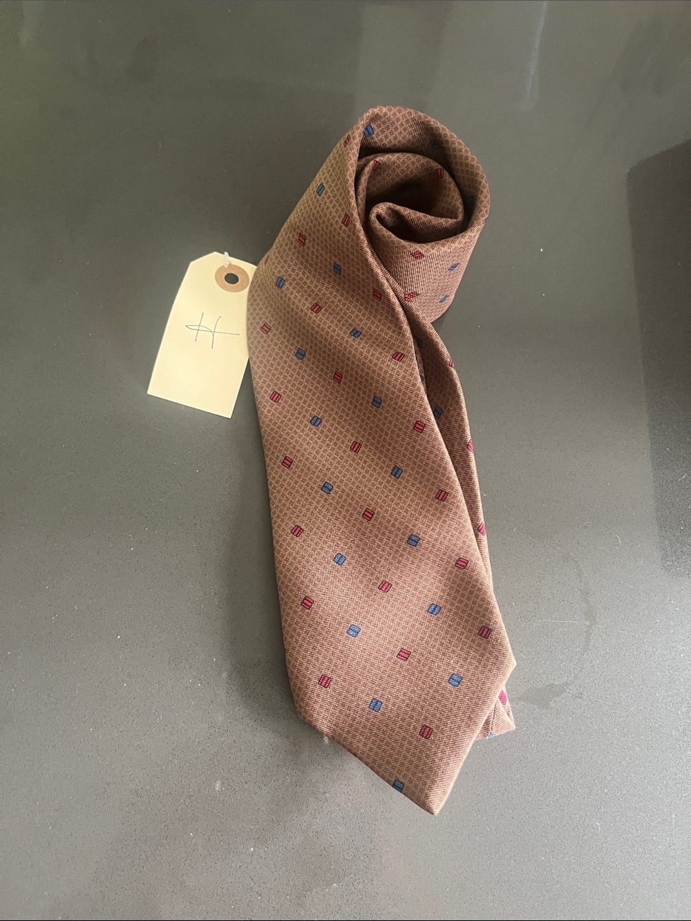 Brown Men's Patterned Silk Tie with Subtle Blue and Red Dots